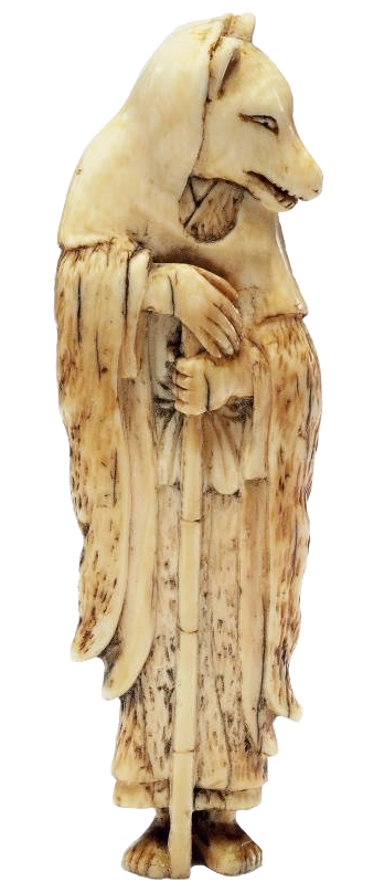 a carved figurine of a fox disguised as a monk